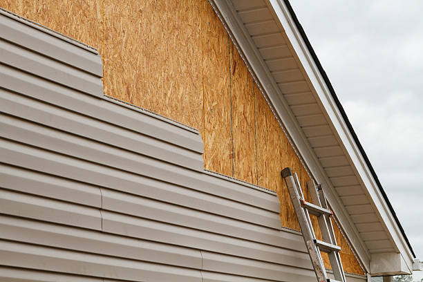 Professional Storm Damage Siding Repair technician working in Springs, PA